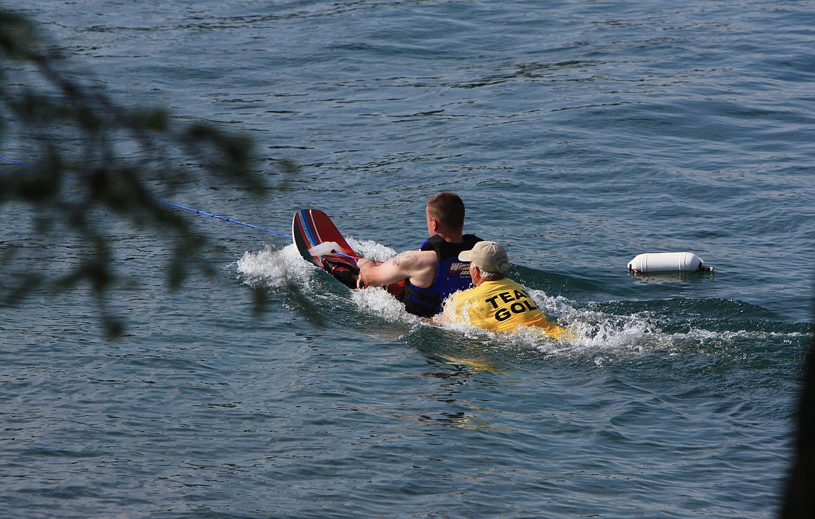 Jerry Mahugh assists a DREAM Adaptive athlete  learning how to sit ski on the water during the first year of the water sports program in 2009. Mahugh was instrumental in starting the program. (Photo provided by DREAM Adaptive)