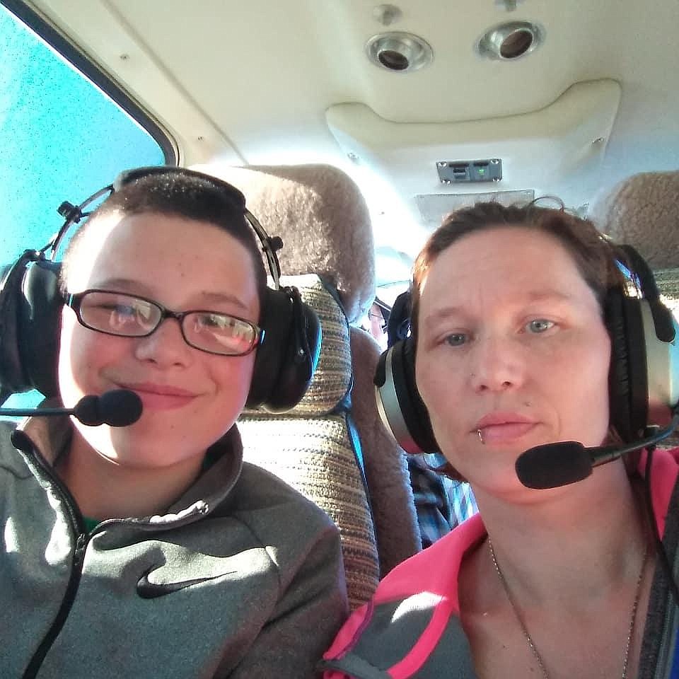 Orion Davis-Lower (left) and his mother, Crystal Lower (right) ride in a small plane provided by charity Angel Flight West to Davis-Lower's heart surgery in Denver. (courtesy photo).
