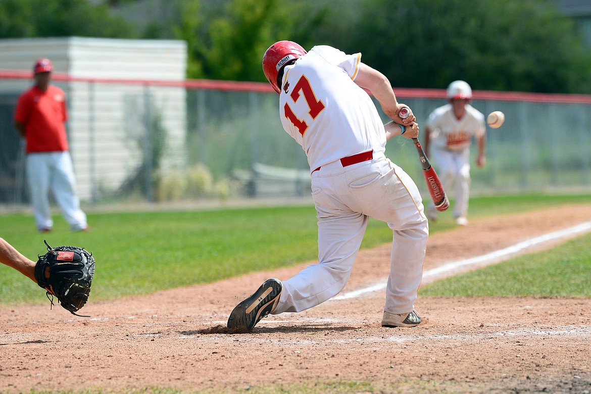 Kalispell Lakers AA’s Hayden Vaughn connects on an RBI single in the bottom of the sixth inning against Belgrade at Griffin Field on Thursday, July 16. (Casey Kreider/Daily Inter Lake)