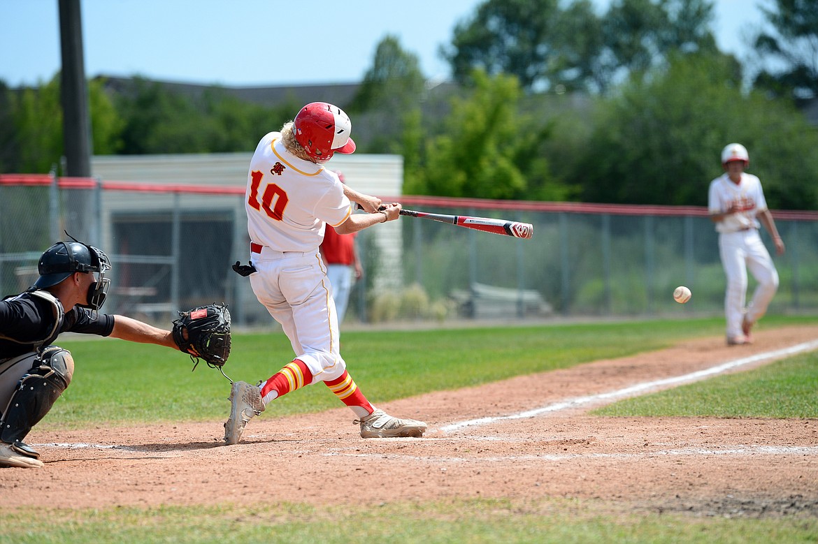 Kalispell Lakers AA’s Connor Drish connects on a two-run single in the bottom of the sixth against Belgrade at Griffin Field on Thursday, July 16. (Casey Kreider/Daily Inter Lake)