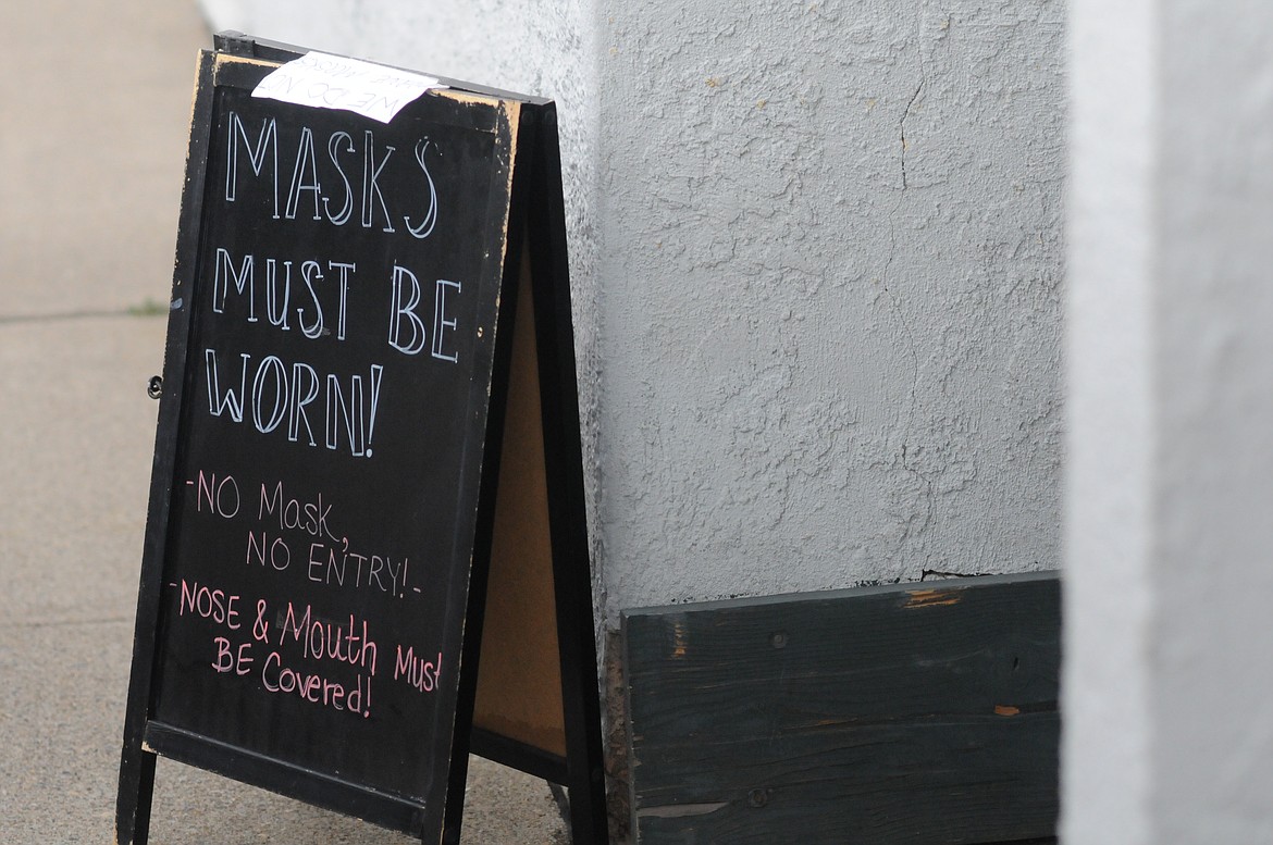 Flyers and sandwich boards displaying new face mask requirements went up across town last week. (Will Langhorne/The Western News)