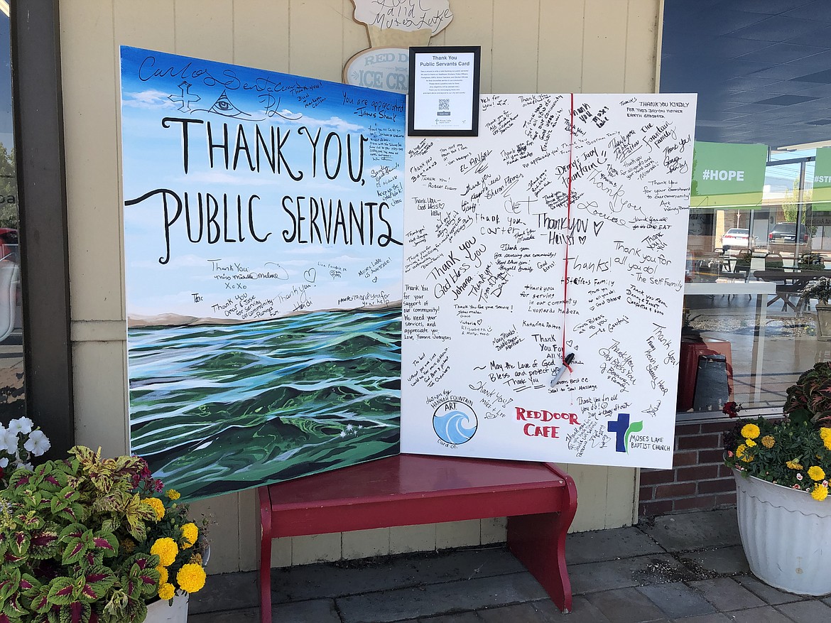 Charles H. Featherstone/Columbia Basin Herald 
 Artist Hannah Fountain created this giant "thank you" card for public servants like first responders, teachers, nurses and doctors, and elected officials, which has been sitting out in front of Red Door Cafe for the last two weeks.