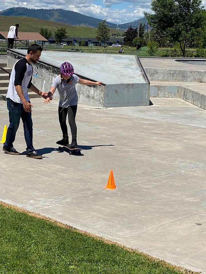 Jesse Vargas helps a new skateboarder at the 2020 7th Ave Skatepark clinic over the week of June 22-26. (Photo provided by Jesse Vargas)