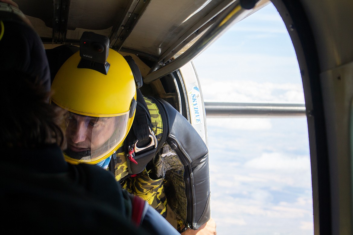 Braden Roseborough gives one last look at his fellow jumpers before making the leap out inin the chilly air at 18,000 feet on Sunday afternoon over Ritzville.