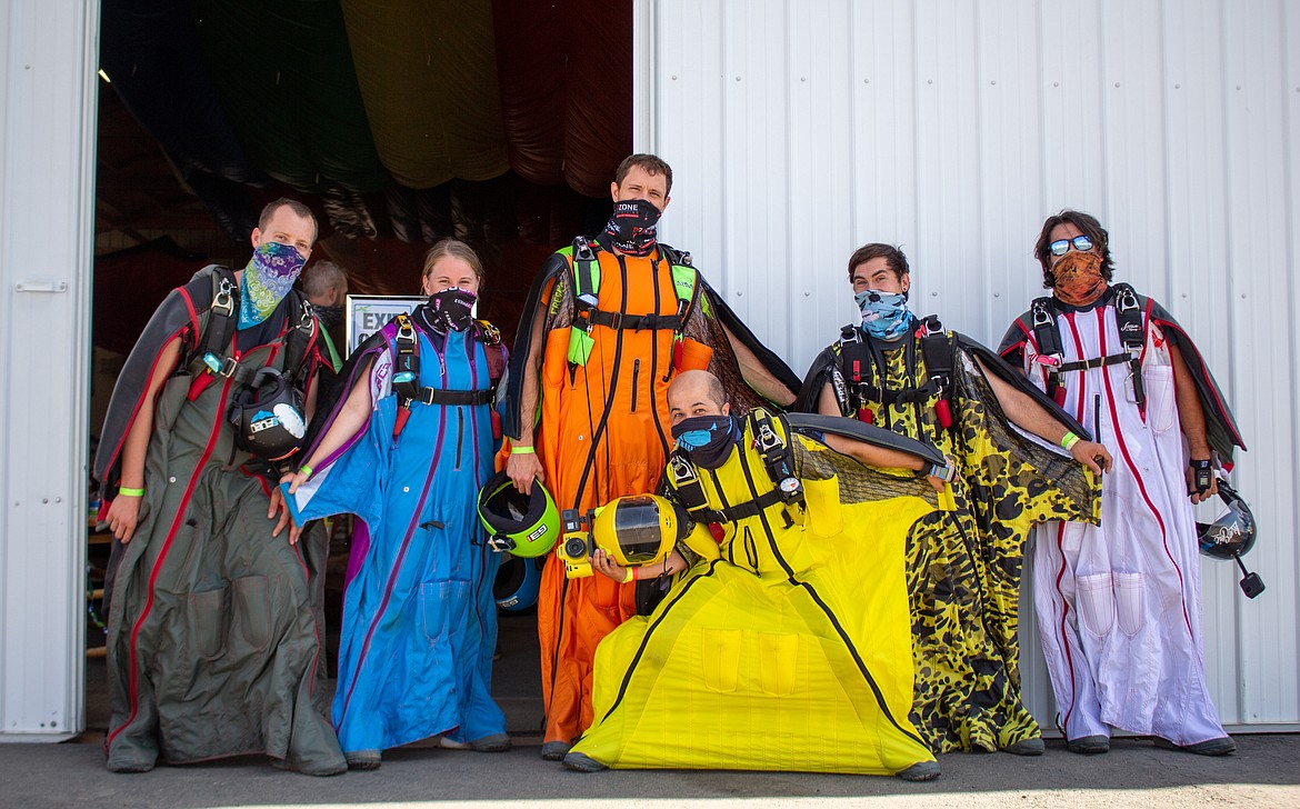 Left to right: Eric Herhager, Lauren Herhager, Eli Weber, Nikko Hall, Braden Roseborough and Ryan Wilson pose together in front of the hangar at Skydive West Plains in Ritzville before a jump on Sunday, July 19.