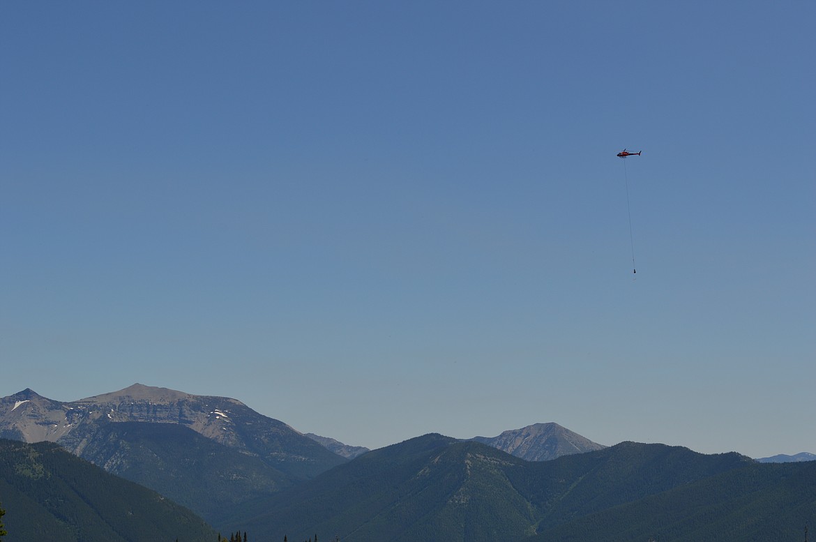 A helicopter airlifts weather station materials and equipment to Tunnel Ridg. (Photo provided by Friends of Flathead Avalanche Center)