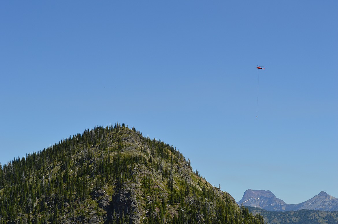 A helicopter airlifts weather station materials and equipment to Tunnel Ridg. (Photo provided by Friends of Flathead Avalanche Center)