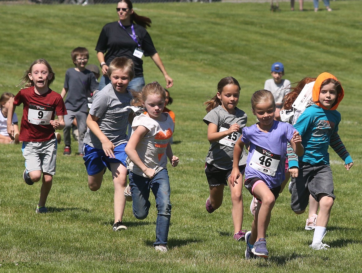 JASON ELLIOTT/Press 
 London Dance leads the pack out of the starting line of Saturday's Run to Summer fun run in Spirit Lake.