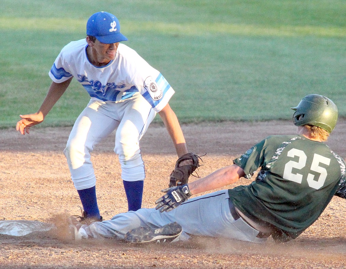 Second baseman Moxley Roesler-Begalke puts the tag on Mission Valley's Brock Henriksen as he attempts to steal for the third out top of the seventh inning. Loggers over Mariners 8-7 in the nine inning nail-biter nightcap. (Paul Sievers/The Western News)