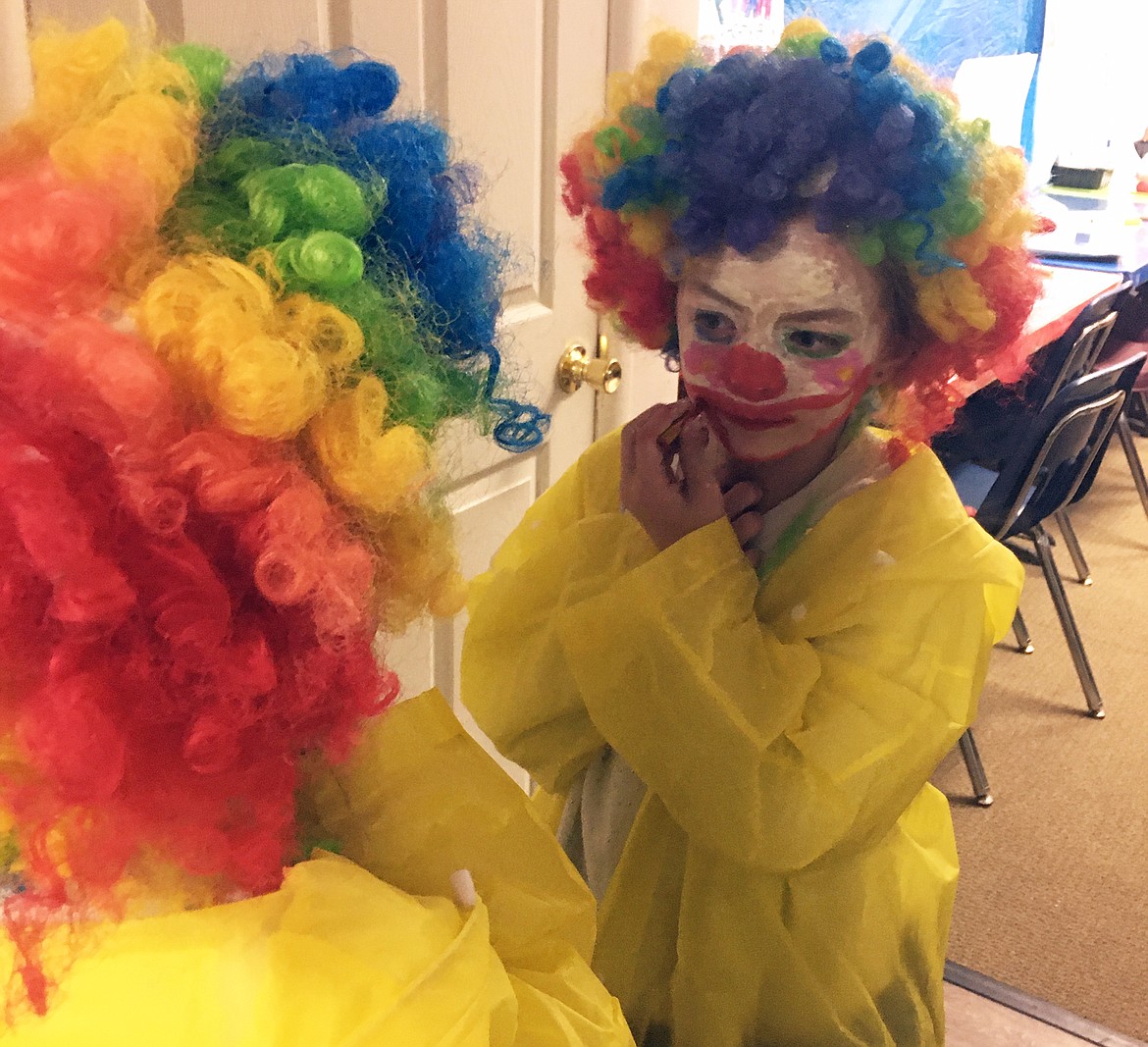 Ellie Woods learns to paint her face as part of the Bigfork A.C.E.S. After School Program's "Under the Big Top" camp, where the kids learned clowning, acrobatics, magic and circus stunts. (photo provided)