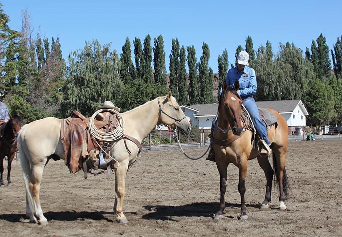 Courtesy Photo/ 
 Kayla Naccarato is one of three riders to accompany horses around the arena as riders took time to remember three of their fallen brethren on Saturday afternoon at the Buckaroo Bash.