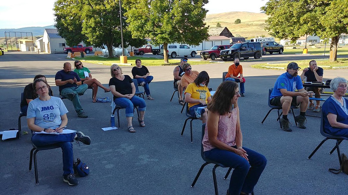 Plains community members hear details about the school reopening plans at an outdoor Plains School Board meeting last week. (Chuck Bandel/Valley Press)