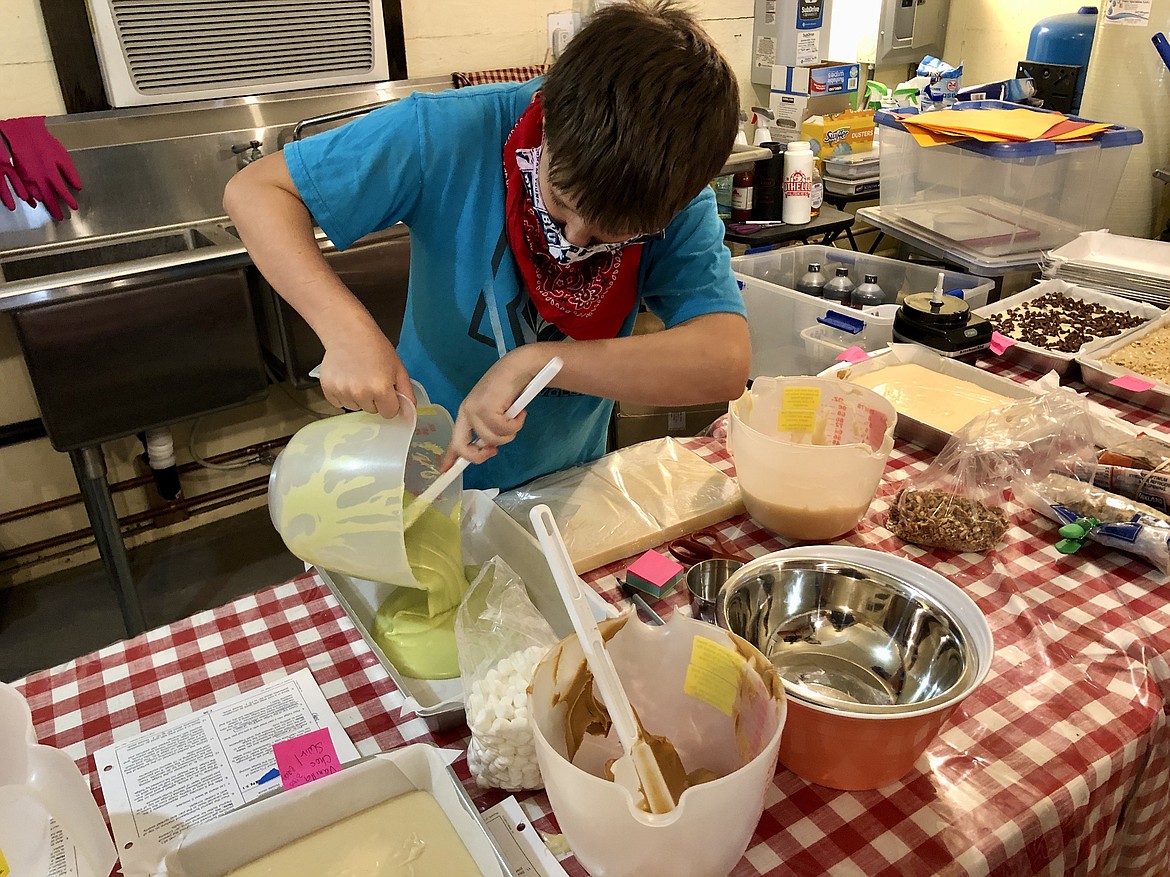 Austin Phillips, 10, ladles out mint fudge.