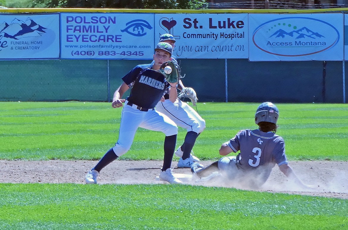 Mariners' Alex Muzquiz catches the ball at second base, narrowly missing the tag out in a game against the Glacier Twins on Saturday, July 25. (Whitney England/Lake County Leader)