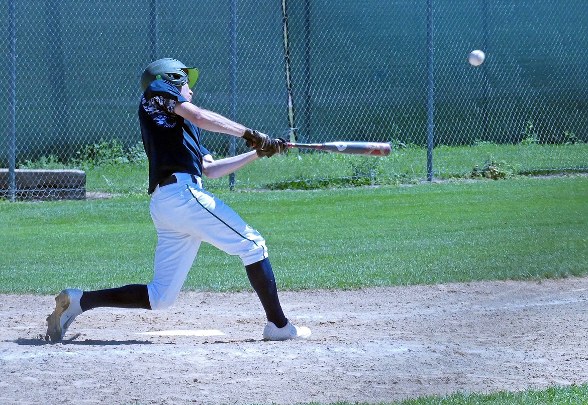 Mission Valley's Keyan Dalby pops up a fly ball in a game against the Glacier Twins on Saturday, July 25. (Whitney England/Lake County Leader)