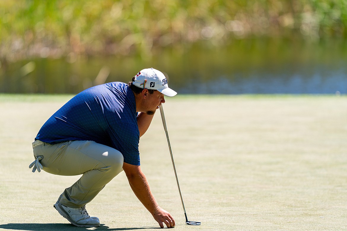Lakeland High product Derek Bayley measures a putt in the PGA Tour’s Barracuda Championship in Truckee, Calif., on Thursday.