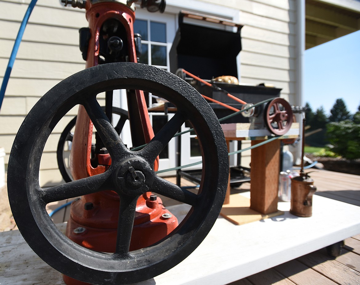 Built from an 1890s steam engine, a Weber grill and a collection of scavenged parts, Don Bumgarner’s rotisserie grill sits outside his house in Lakeside. (Jeremy Weber/Daily Inter Lake)