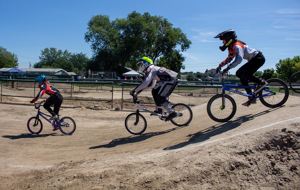 BMX riders race down the ramp after the first turn at the Moses Lake BMX track on Sunday afternoon as Moses Lake BMX hosted a single-point race event.