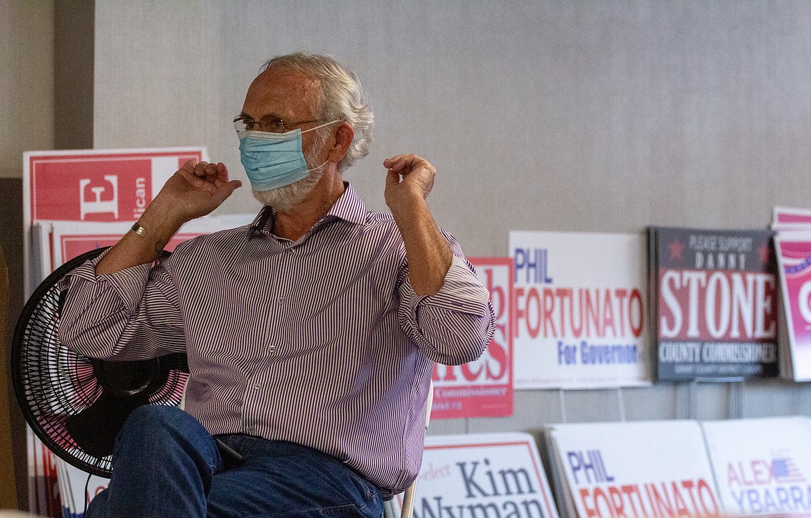 Casey McCarthy/Columbia Basin Herald 
 Rep. Dan Newhouse, R-Sunnyside, wears a mask during his visit to the new headquarters of the Grant County Republican Party in downtown Moses Lake.