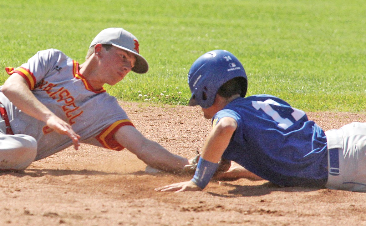 Shortstop Wyatt Freund’s tag is late as Jeff Offenbecher steals second top of the sixth inning with two outs during the July 30 matchup with the Lakers. (Paul Sievers/The Western News)