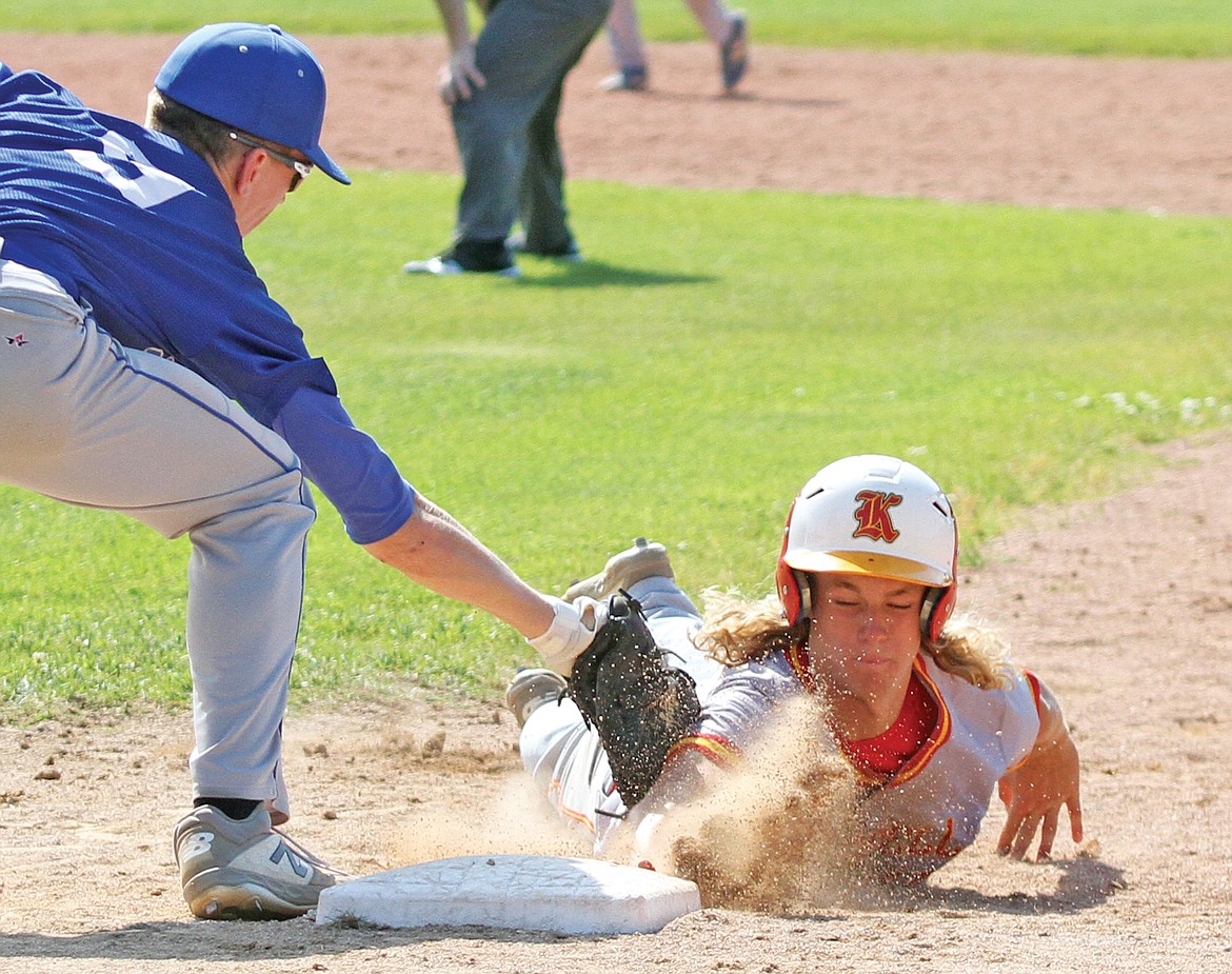 Kalispell's Samuel Manaker leads off a bit too far gets picked off by first baseman Caden Williams bottom of seventh inning in first game of the district tournament Thursday, July 30. (Paul Sievers/The Western News)