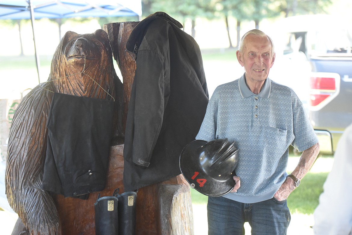 Retired Libby volunteer fireman Marshall Warrington, 91, with his bunker suit. (Will Langhorne/The Western News)