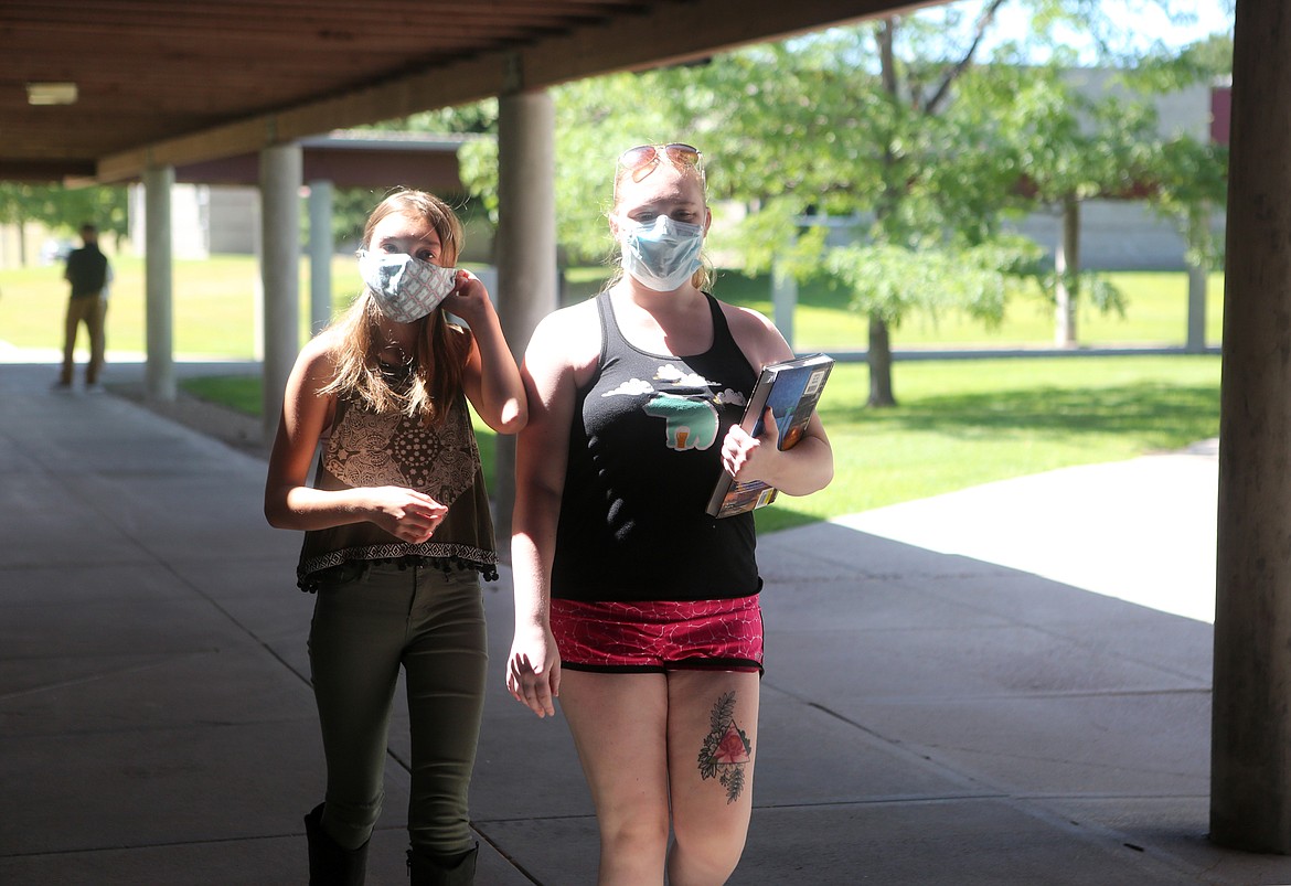 Makayla Otto and Brittany Lockhart walk through the campus at Flathead Valley Community College on Monday.  (Mackenzie Reiss/Daily Inter Lake)