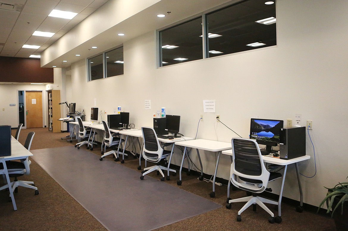 Computers are spaced out at least six feet apart inside the Broussard Family Library and Learning Commons.  (Mackenzie Reiss/Daily Inter Lake)