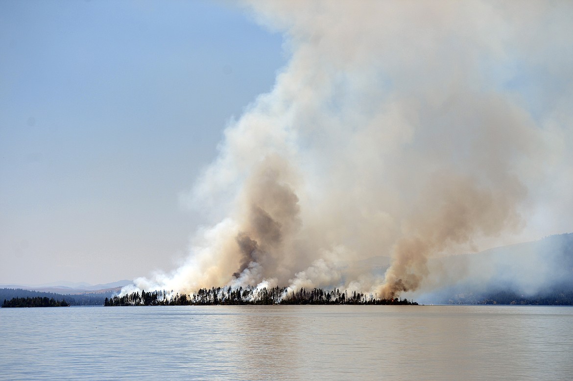 Plumes of smoke rise from a wildfire on Bird Island on Flathead Lake near Finley Point on Tuesday, Aug. 4, 2020. (Casey Kreider/Daily Inter Lake)