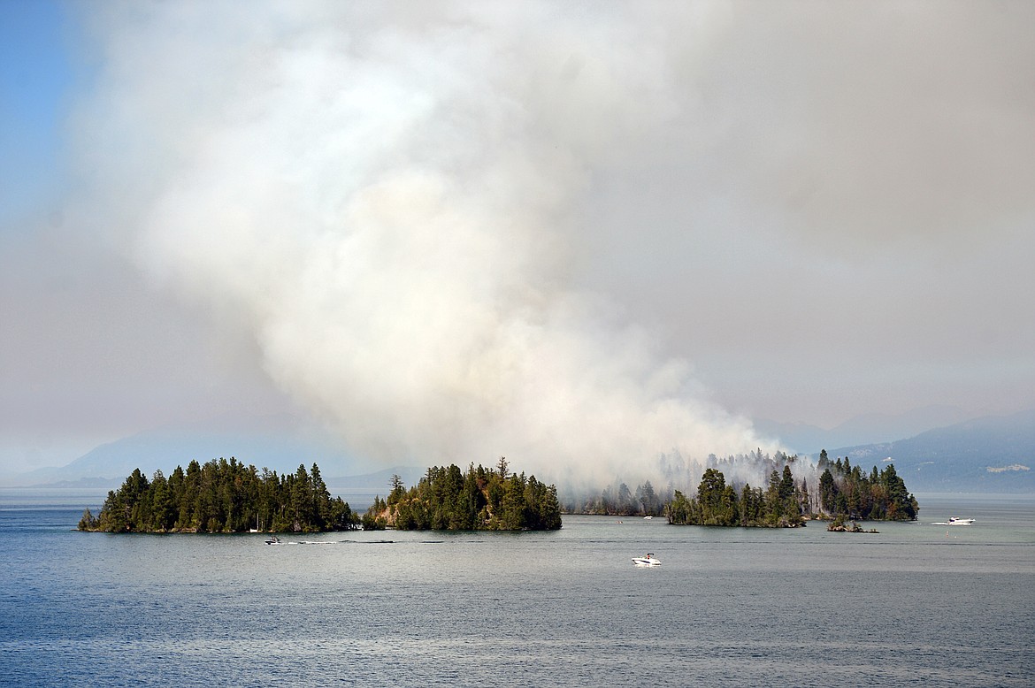 Smoke billows from a wildfire on Bird Island on Flathead Lake near Finley Point on Tuesday, Aug. 4. (Casey Kreider/Daily Inter Lake)