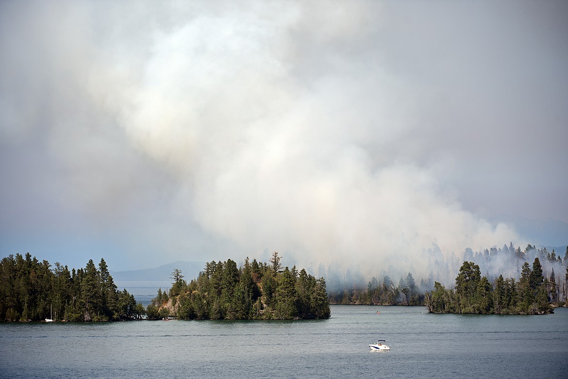 Smoke billows from a wildfire on Bird Island on Flathead Lake near Finley Point on Tuesday, Aug. 4. (Casey Kreider/Daily Inter Lake)