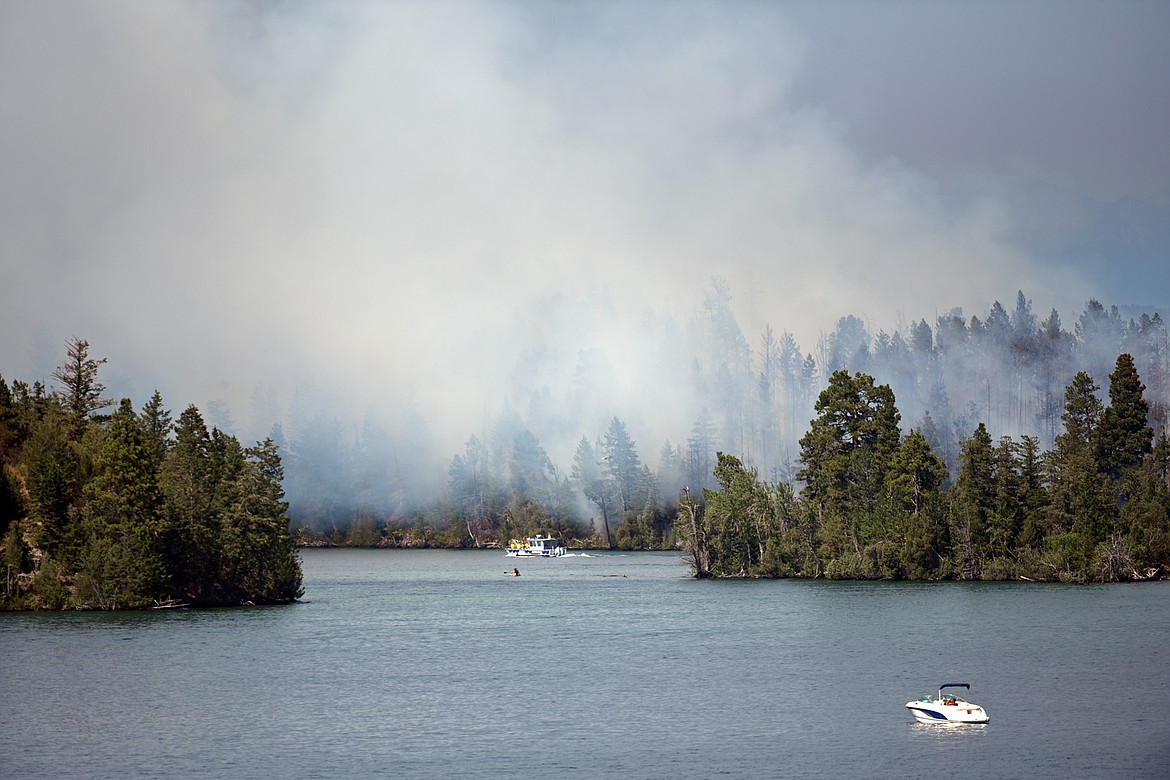 Smoke billows from a wildfire on Bird Island on Flathead Lake near Finley Point on Tuesday, Aug. 4. (Casey Kreider/Daily Inter Lake)