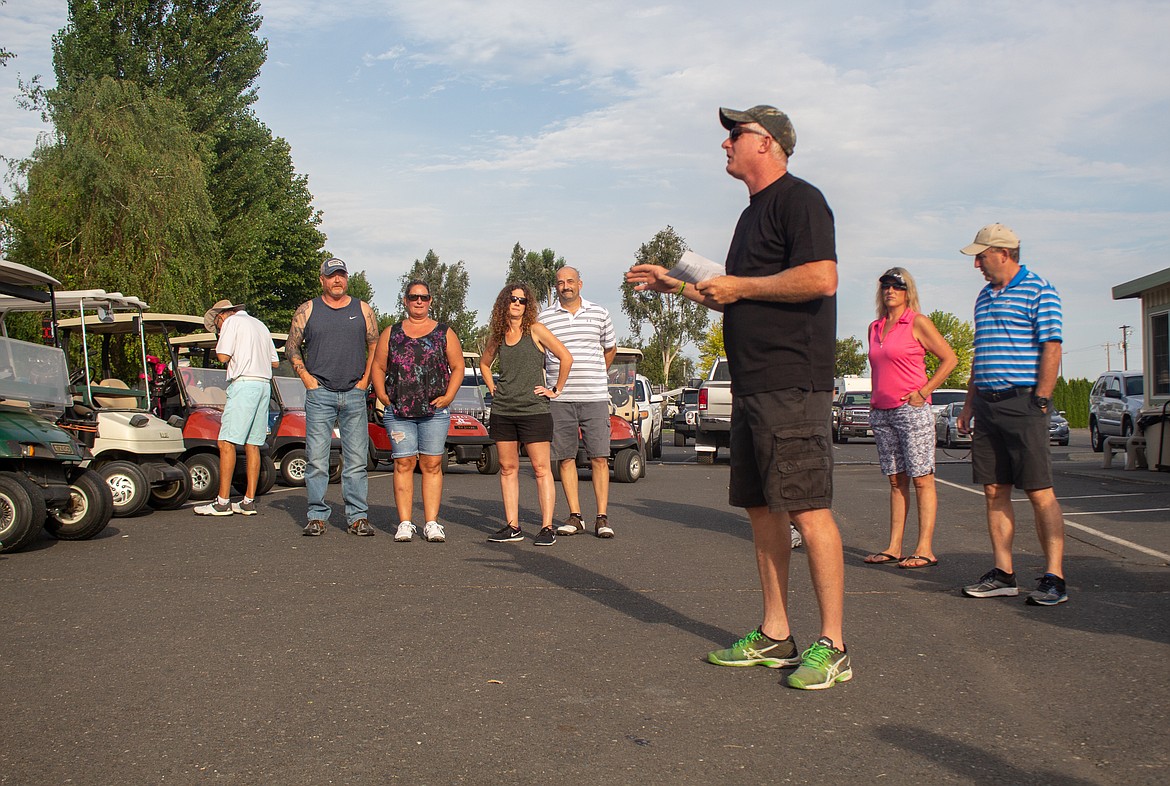 The Legacy Golf Course General Manager Charlie Jenkins addresses golfers before the Special Olympics fundraising tournament kicks off on Saturday morning.