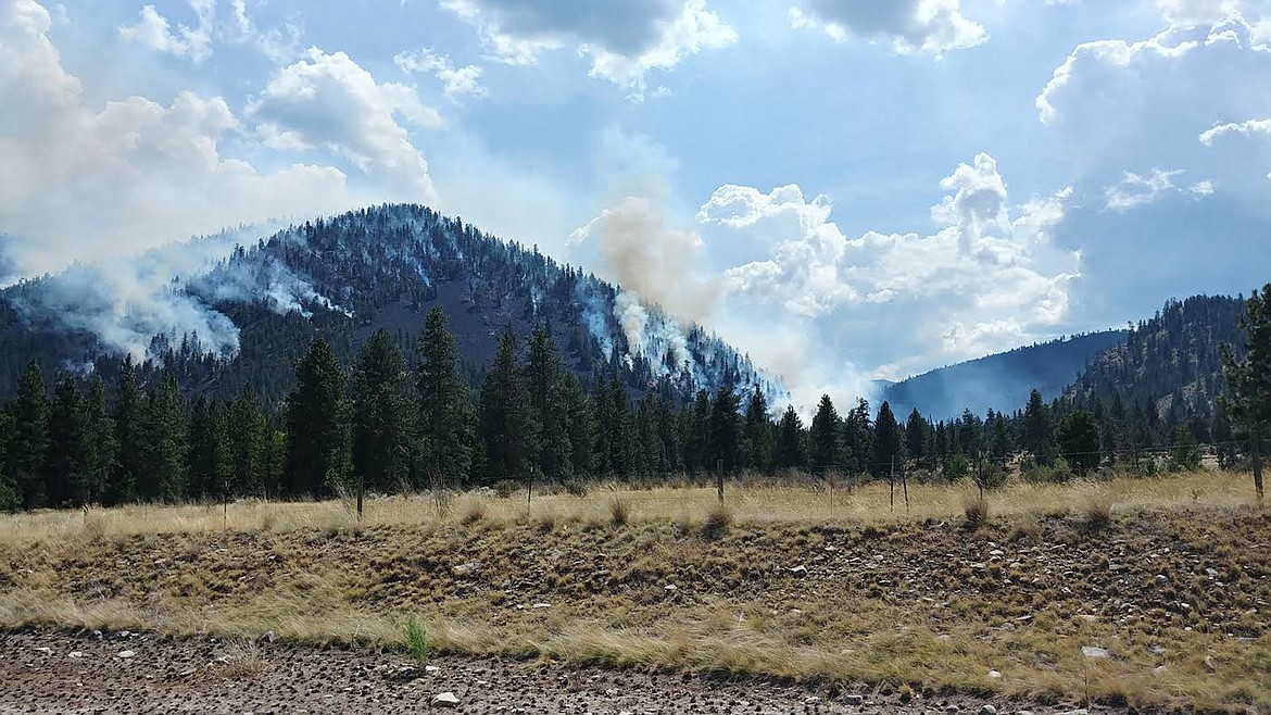 Smoke pours from the Magpie Rock Fire last week along Montana 200. The blaze has burned more than 3,600 acres in Sanders County. (Chuck Bandel/Valley Press)