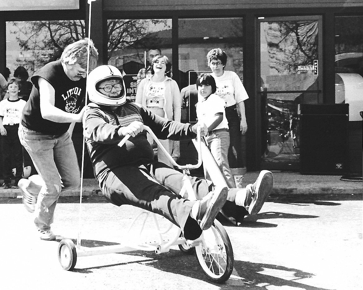Lee Blackwell in a tricycle race competing against various Grants Pass companies, each company entering several contestants, in the late 1970s.