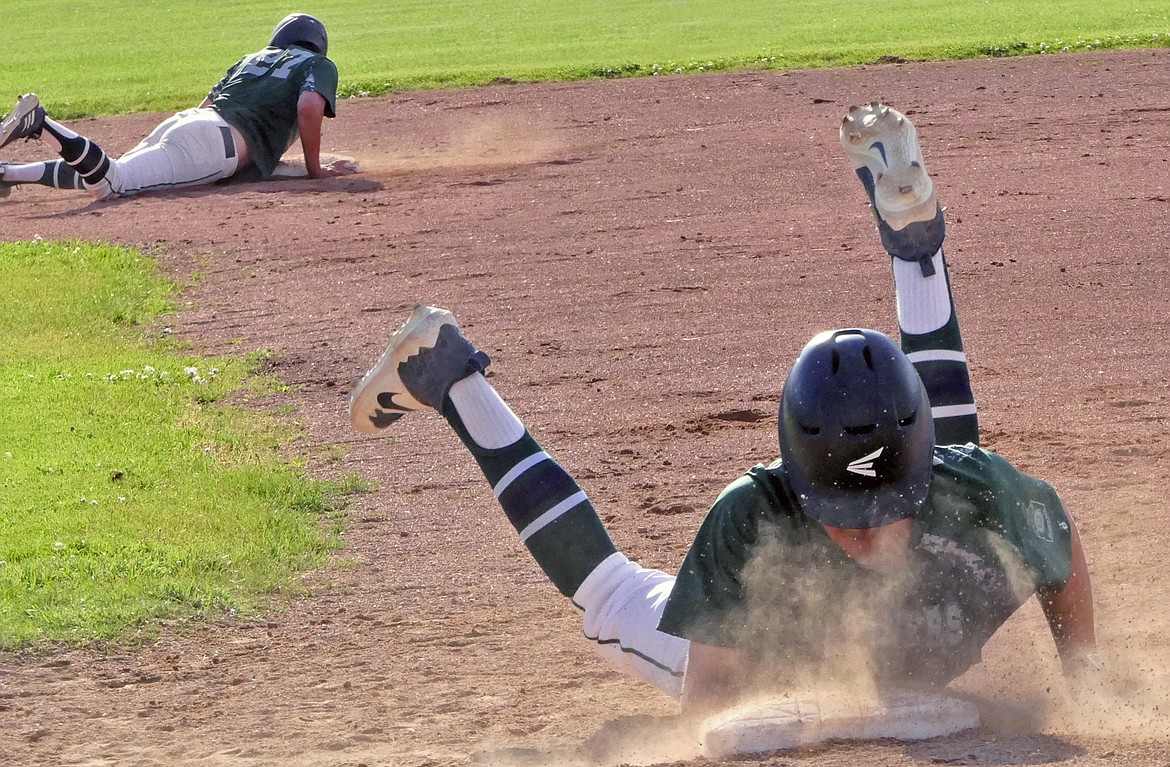Mission Valley Mariners players James Bennett and Ethan McCauley dive back to base after a fly ball is caught by the Missoula Mavericks during a game at the Class A Legion Baseball Western District Tournament on Thursday, July 30 in Florence. (Whitney England/Lake County Leader)