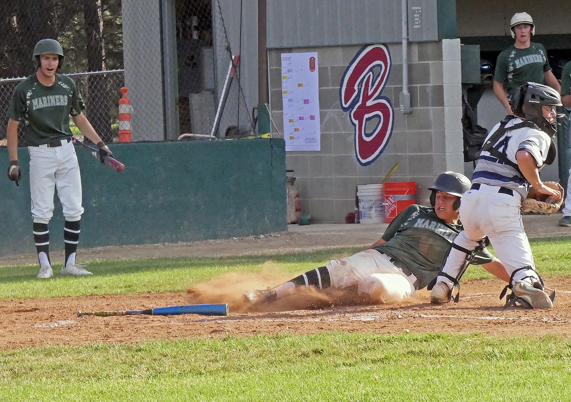 Mission Valley’s James Bennett slides onto home plate, recording run for his team in the second inning against the Missoula Mavericks during the Class A Legion Baseball Western District Tournament on Thursday, July 30 in Florence. (Whitney England/Lake County Leader)