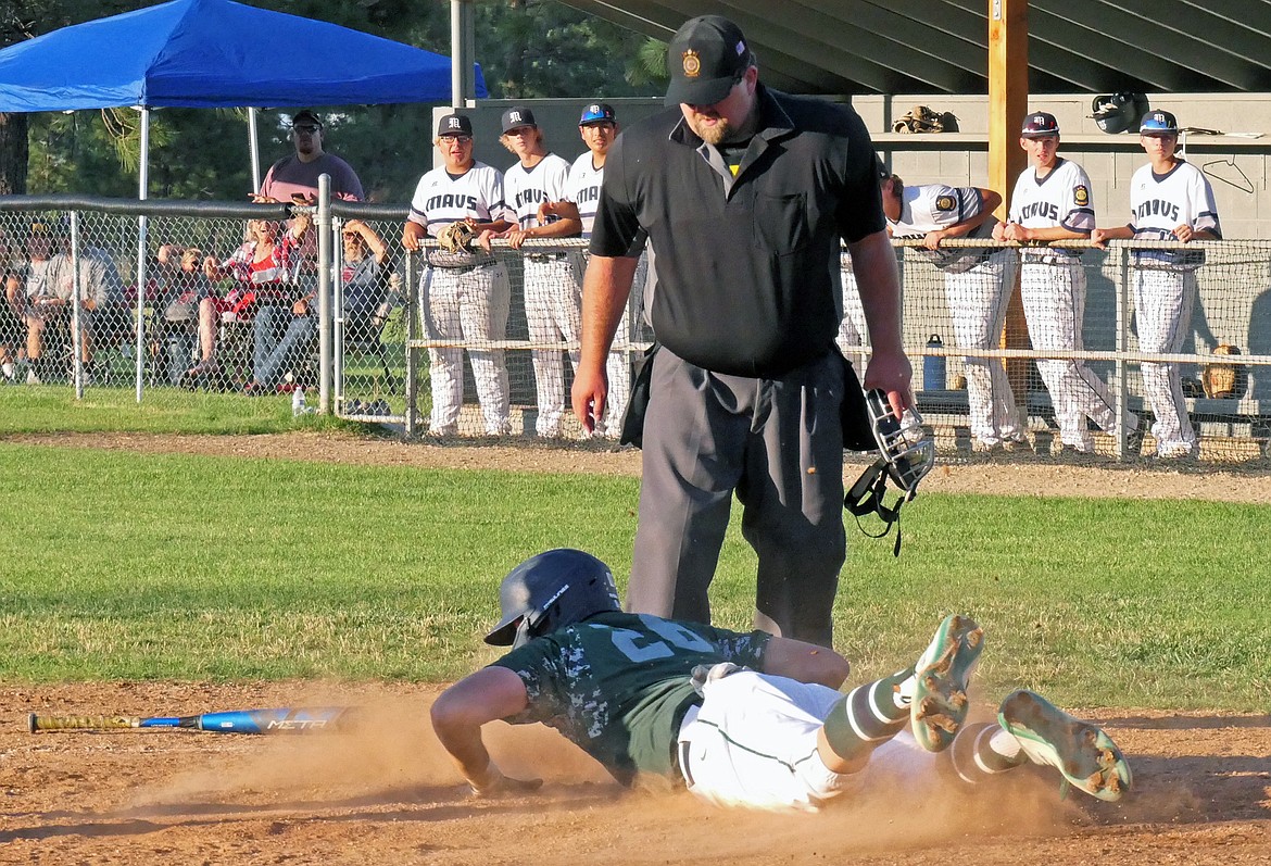 Mission Valley Mariners player Trevor Lake slides home to tie up the score in the eighth inning against the Missoula Mavericks during the Class A Legion Baseball Western District Tournament on Thursday, July 30 in Florence. (Whitney England/Lake County Leader)