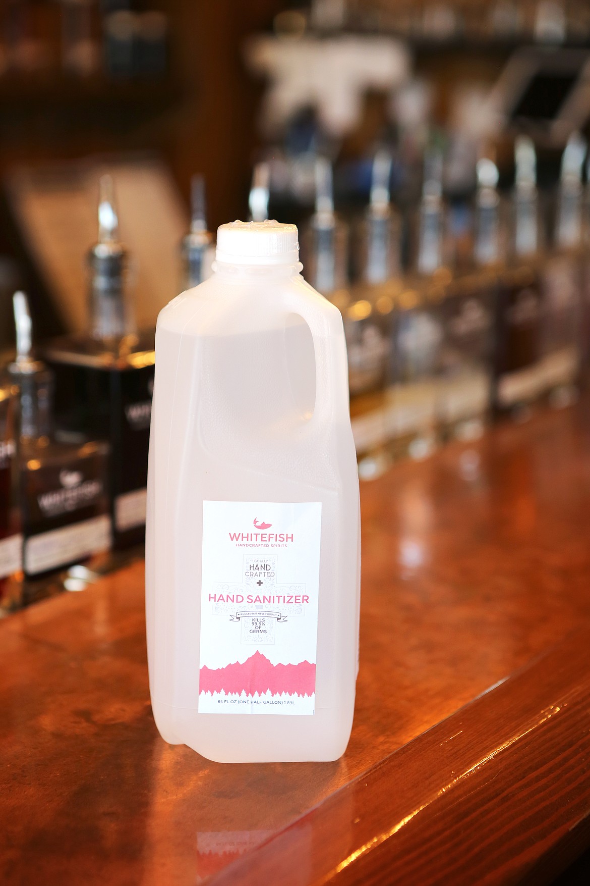 Hand sanitizer created by the team at Whitefish Handcrafted Spirits is pictured on the bar at their Evergreen location. (Mackenzie Reiss/Daily Inter Lake)