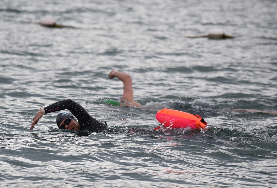 Carrie Jacobs swims in the Swim the Fish event Saturday off City Beach at Whitefish Lake. (Heidi Desch/Whitefish Pilot)