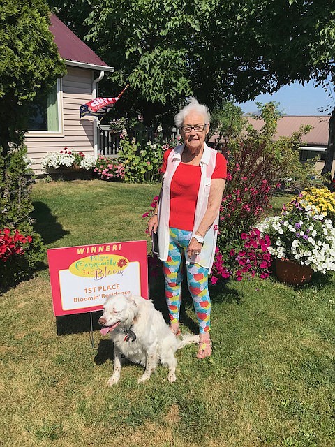 The Polson in Bloom first place Residence Winner Lyn Opalka and her dog Jill.