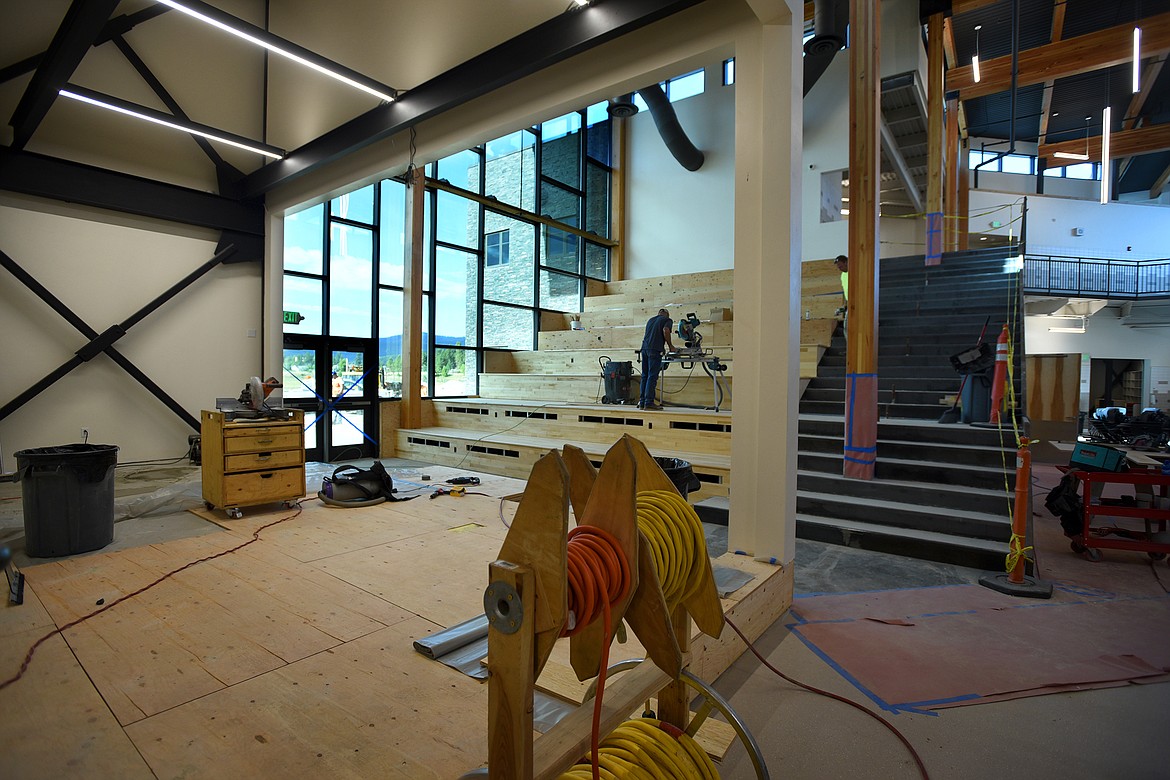 Crews work on risers where audiences will sit for stage performance in the new Somers Middle School on Tuesday, Aug. 11. (Daily Inter Lake/Jeremy Weber)