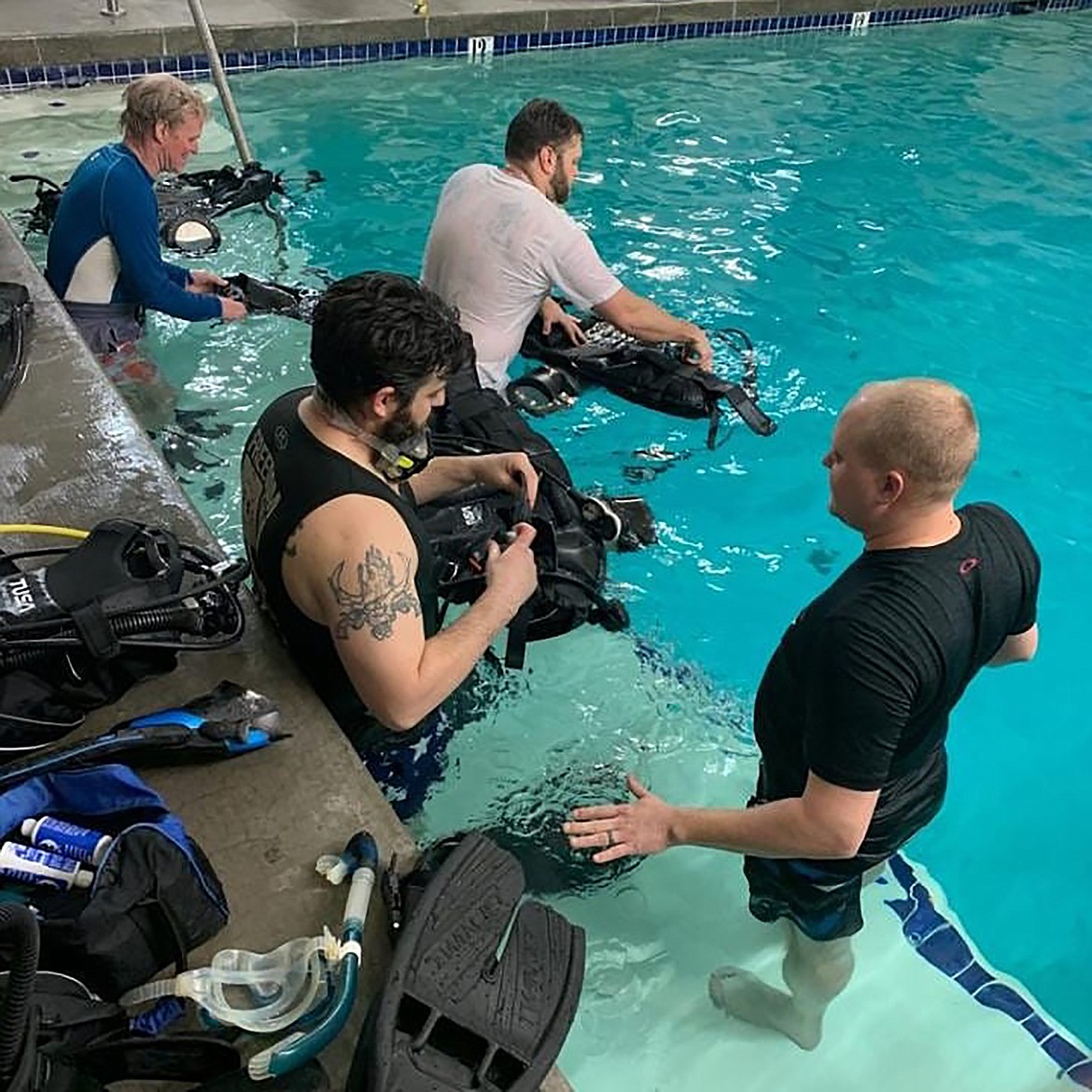 Glen McKinnon, upper left, takes to the training pool at Flathead Scuba along with fellow instructor Chuck Williams, bottom right.