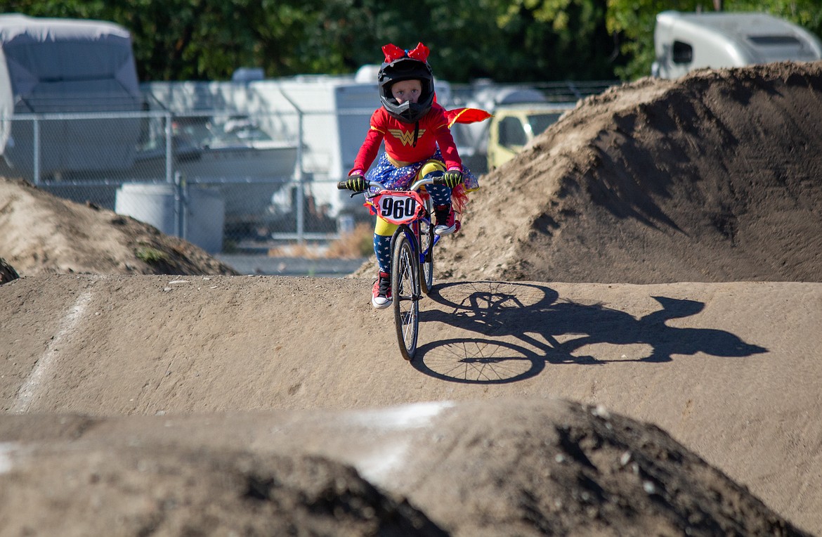 Casey McCarthy/Columbia Basin Herald
Paislee Moore, 5, from Spokane, in a Wonder Woman outfit made her way around the BMX Track in Moses Lake on Saturday.