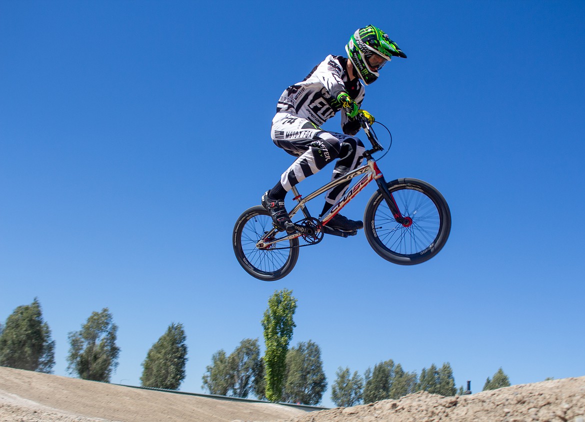 Casey McCarthy/Columbia Basin Herald 
 John Nelson, 23, soars above the BMX Track in Moses Lake early Saturday afternoon as riders came out for the single-point race event hosted by Moses Lake BMX.