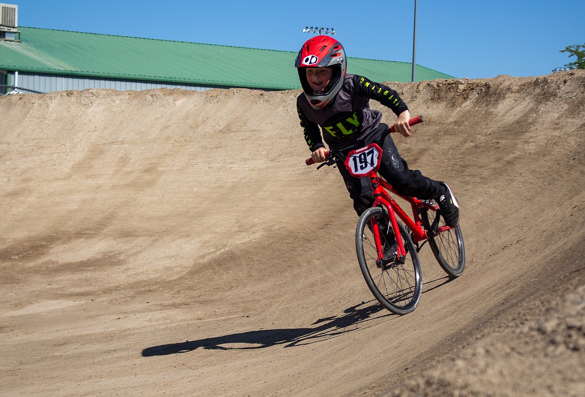 Casey McCarthy/Columbia Basin Herald
Maximus Moore, 7, powers out of the second turn on the BMX track in Moses Lake on Saturday during the single-point race event hosted by Moses Lake BMX.