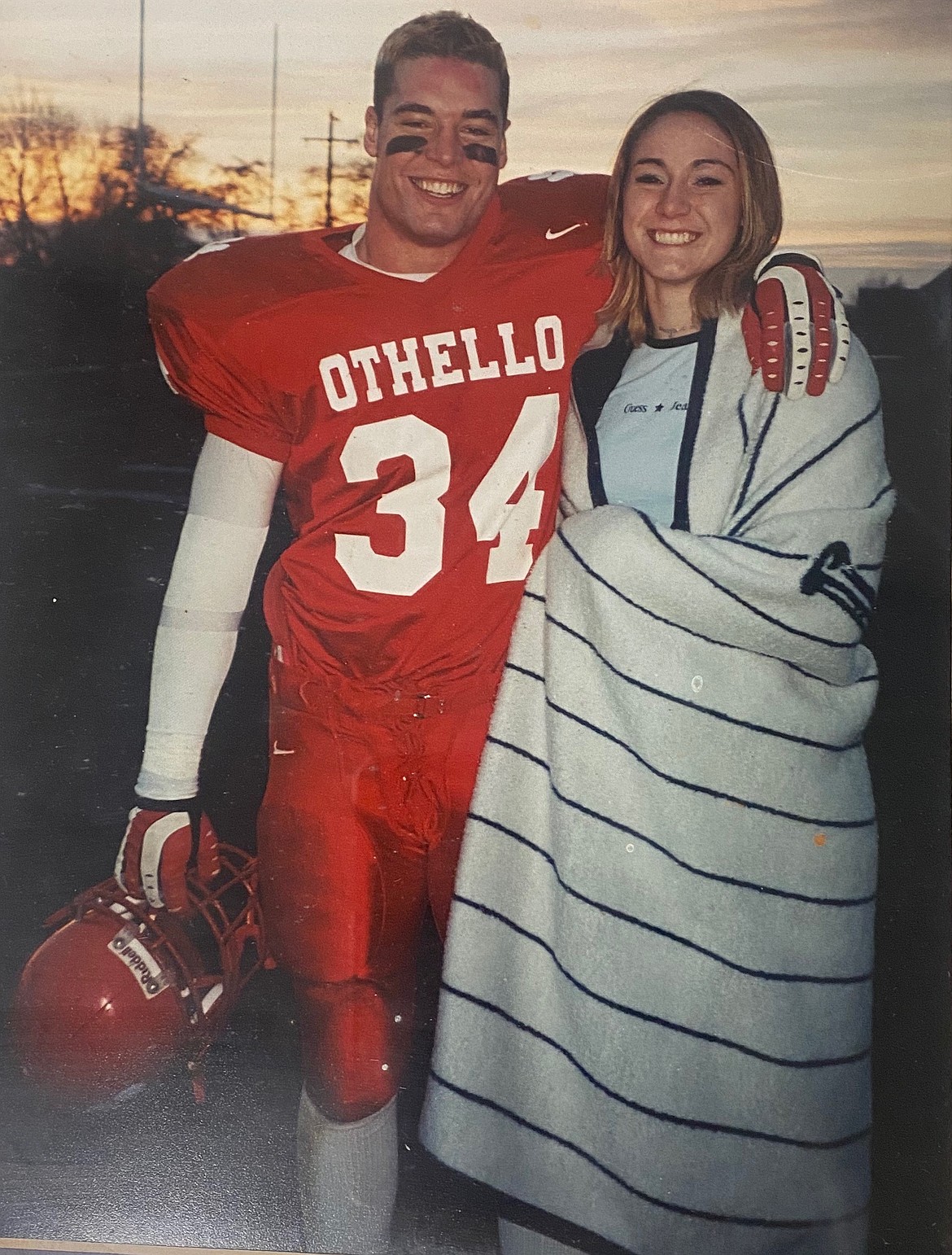 Courtesy Photo/
Dan and Jenny McCourtie share a moment together after one of Dan’s football games for Othello High School.