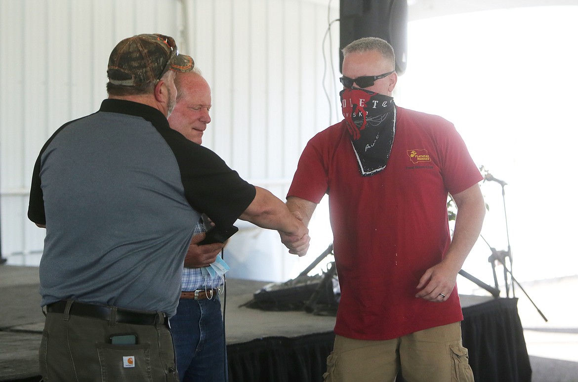 Arthur Woolley of the Flathead Marines accepts the blue ribbon for the 2020 Best Food of the Fair on Wednesday, Aug. 19 at the Huckleberry Stage. (Mackenzie Reiss/Daily Inter Lake)