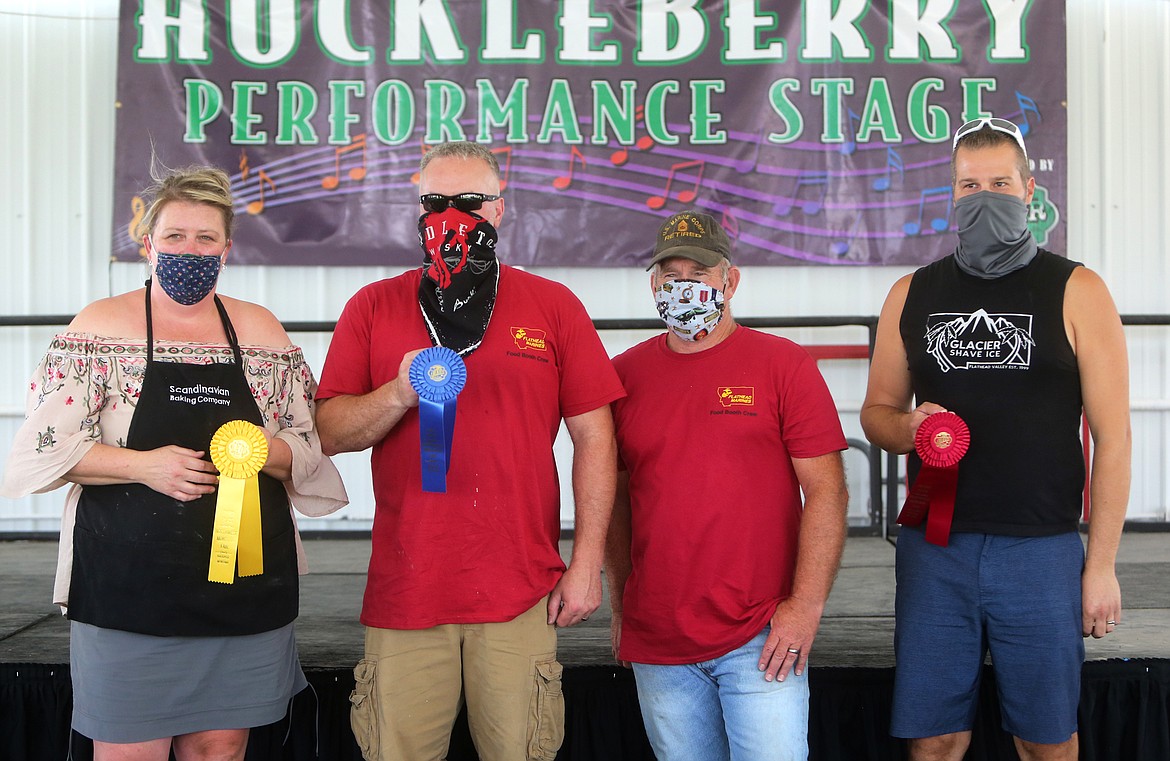 Winners of the 2020 Northwest Montana Best Food of the Fair Awards are from left, Mette Cephers of the Scandanavian Baking Company in third place, Arthur Woolley of the Flathead Marines in first place and on the far right, Levi Nickel of Glacier Shave Ice, who took second. (Mackenzie Reiss/Daily Inter Lake)