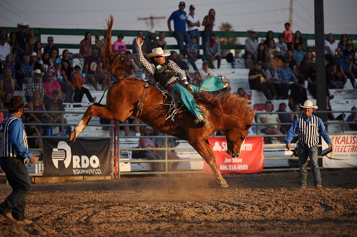 Tanner Aus, from Granite Falls, Minnesota, rides Guardian Angel for a score of 87.5 during bareback riding at the Northwest Montana Fair & Rodeo on Friday, Aug. 21. (Casey Kreider/Daily Inter Lake)